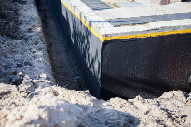 Professional Basement Waterproofing technician working in Savage, MD